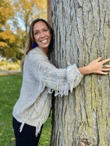 Woman hugging tree being dumb