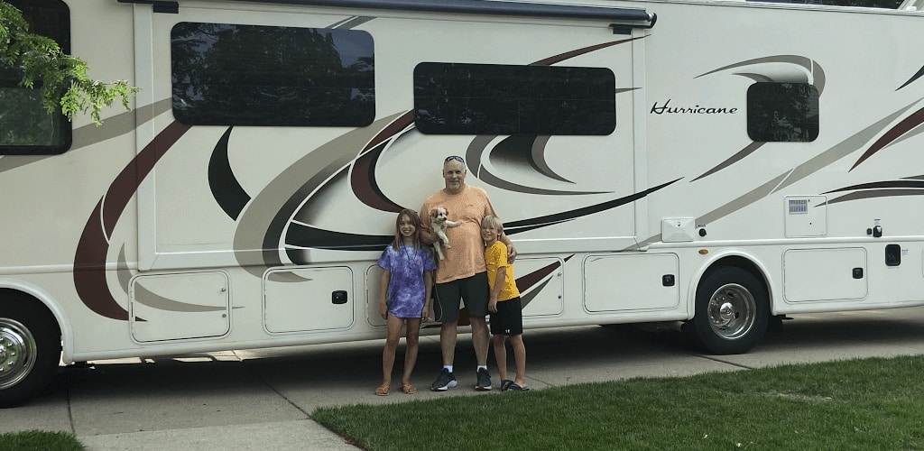 Family in front of an RV