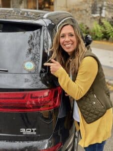 Woman next to car Gratitude