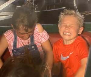 Boy and girl on a roller coaster