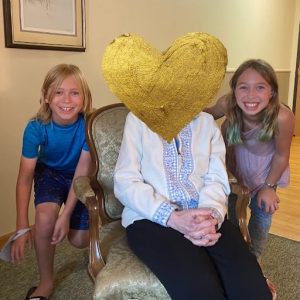 two children with their grandma repeat