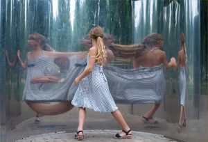 young girl in a hall of mirrors