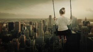 little girl on a swing