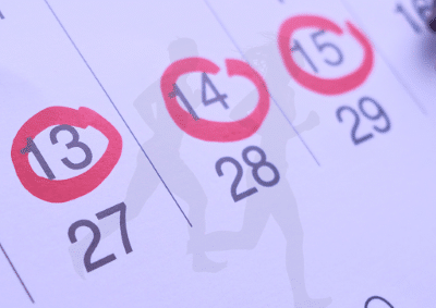 Photo of a calendar with red circles drawn around some of the dates