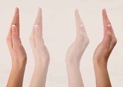 Image of the sides of open hands, palms facing each other, as if to show them moving together and apart